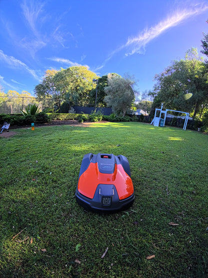 Automower 540 EPOS on lawn near trees