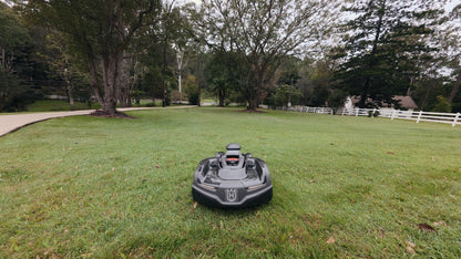 Automower 435X AWD parked on driveway near home