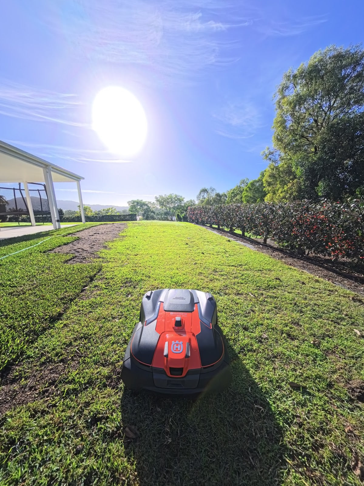Automower 580L EPOS on lawn near property edge