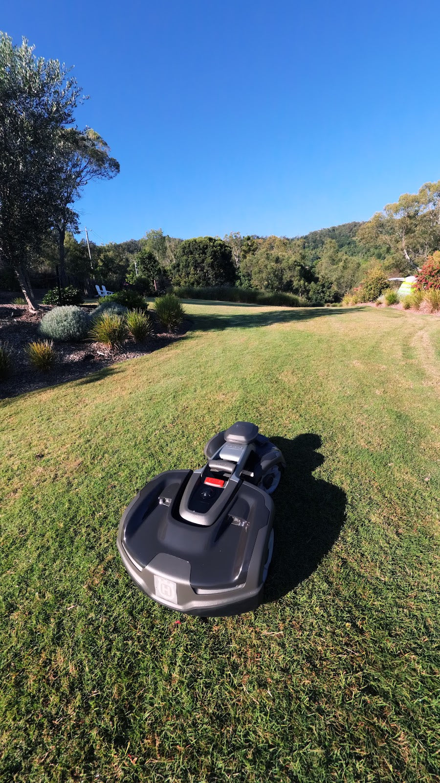 Automower 435X AWD installed on a sloped residential lawn