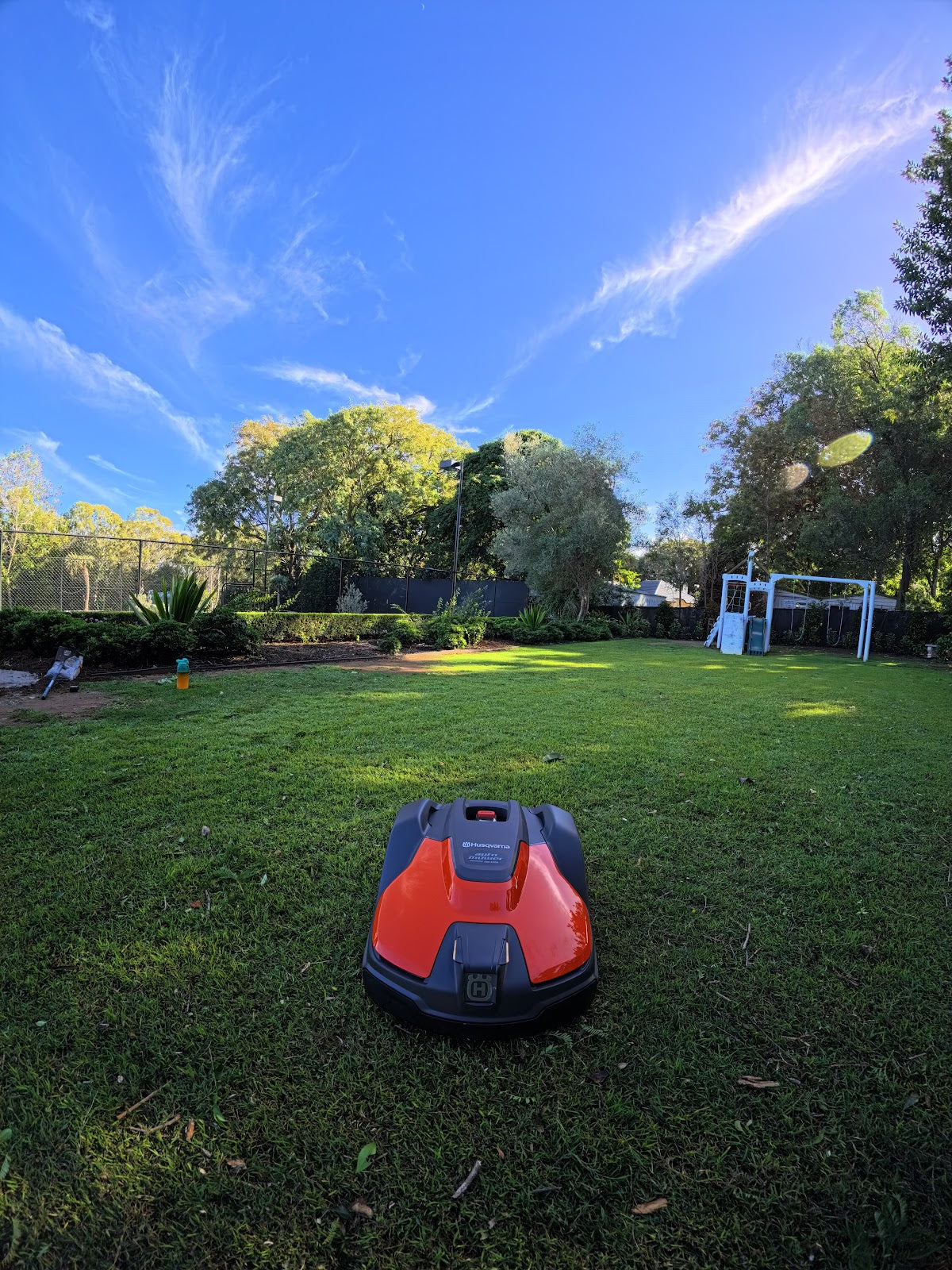 Automower 540 EPOS on lawn edge near garden