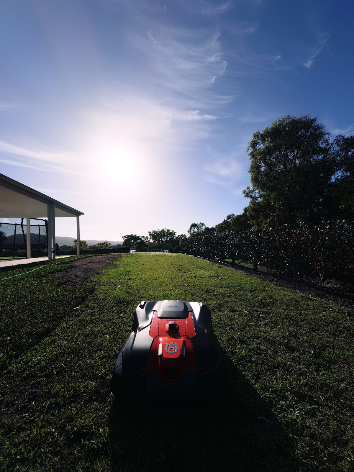 Automower 580L EPOS on lawn against sun