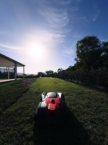 Automower 580L EPOS on lawn against sun
